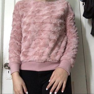 A small fuzzy pink long sleeve.
